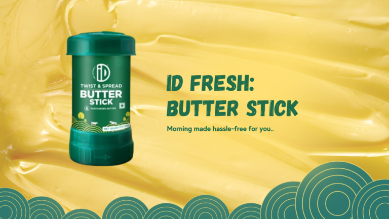 Image of a green twist and spread butter stick on a vibrant yellow background with blue swirls. The text ‘ID Fresh: Butter Stick. Morning made hassle-free for you.